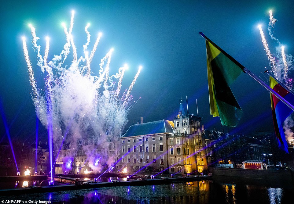 A new firework display on and above the Binnenhof and Hofvijver near the Dutch parliament in The Hague marks the start of the new year 2020 during the National Countdown Moment