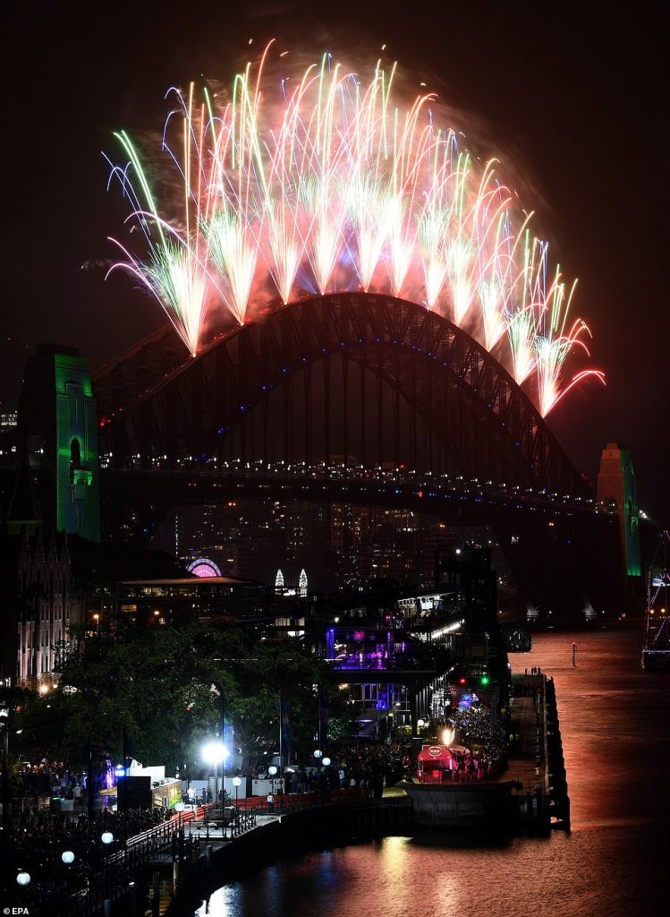 Fireworks explode over Sydney Harbour as part of New Year's Eve celebrations in Sydney
