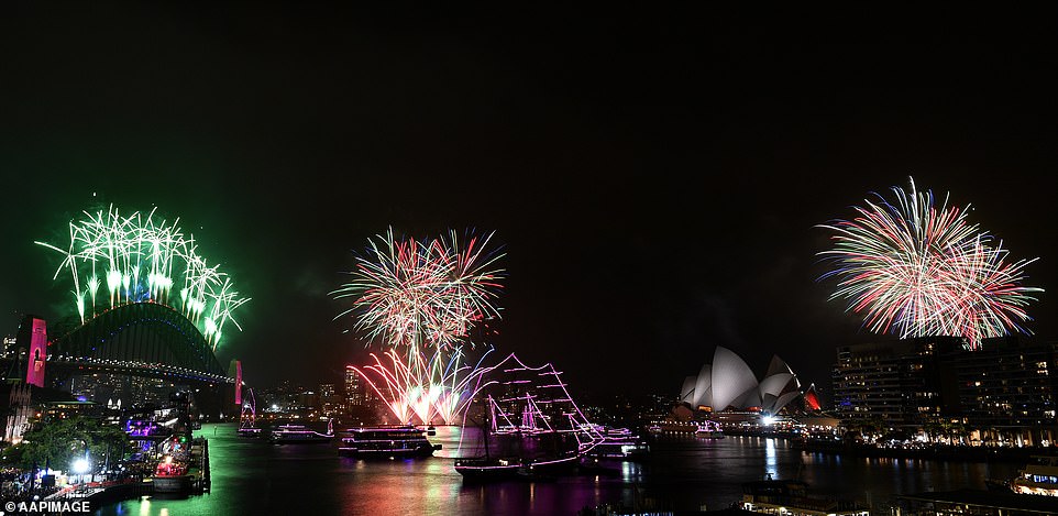 Fireworks explode to welcome in the New Year over the Sydney Harbour Bridge and the Sydney Opera House