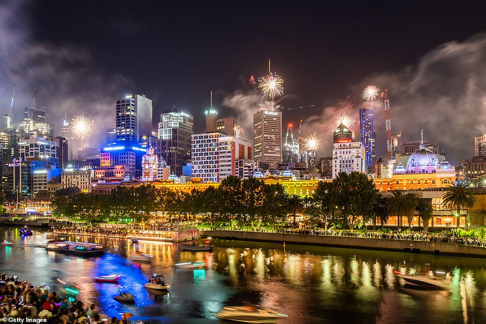 Fireworks erupt over the Melbourne central business district during New Year's Eve celebrations