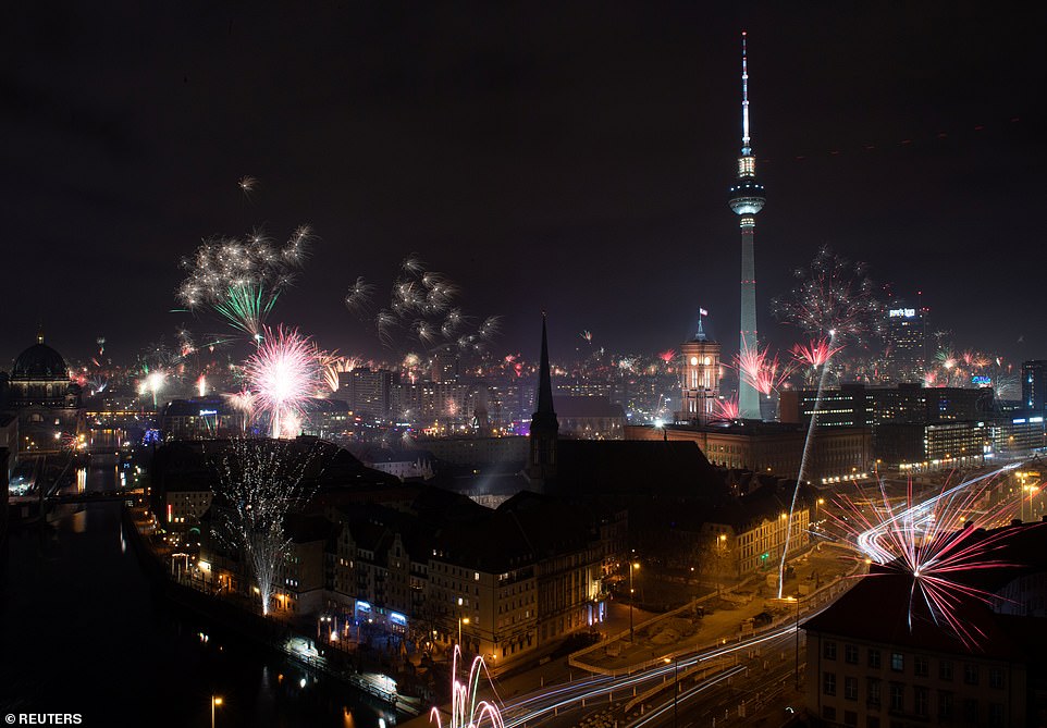 Fireworks explode around the Berlin television tower during New Year celebrations in Berlin, Germany, January 1, 2020