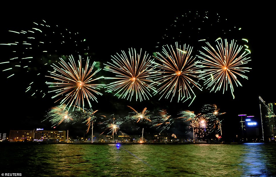 Fireworks explode over Daugava river during New Year celebration in Riga, Latvia January 1, 2020