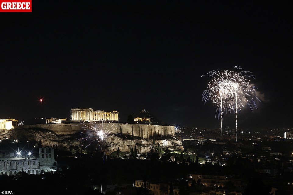Fireworks illuminate the Athenian sky as the temple of Parthenon sits atop the Acropolis hill during the New Year celebrations in Athens Greece, 01 January, 2020