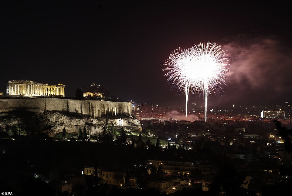 Fireworks illuminate the Athenian sky as the temple of Parthenon sits atop the Acropolis hill during the New Year celebrations in Athens Greece, 01 January 2020