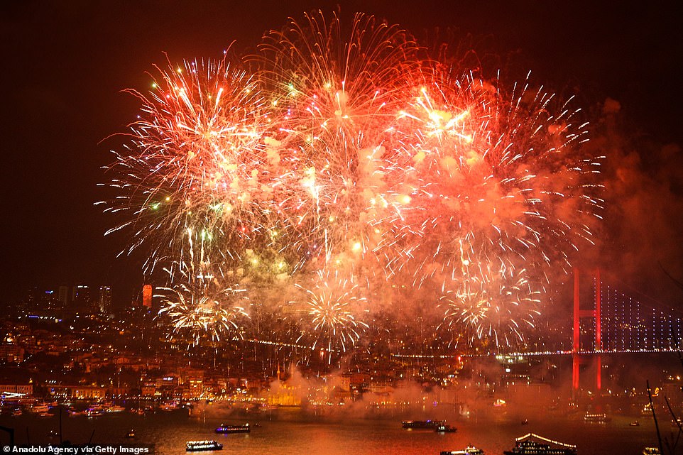Fireworks illuminate the night sky in front of Ortakoy Mosque and July 15 Martyrs' Bridge within the new year celebrations in Istanbul, Turkey on January 01, 2020
