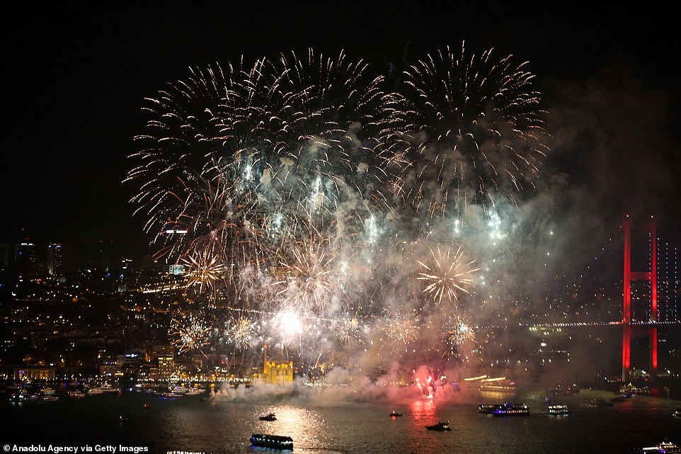 Fireworks illuminate the night sky in front of Ortakoy Mosque and July 15 Martyrs' Bridge within the new year celebrations in Istanbul, Turkey on January 01, 2020