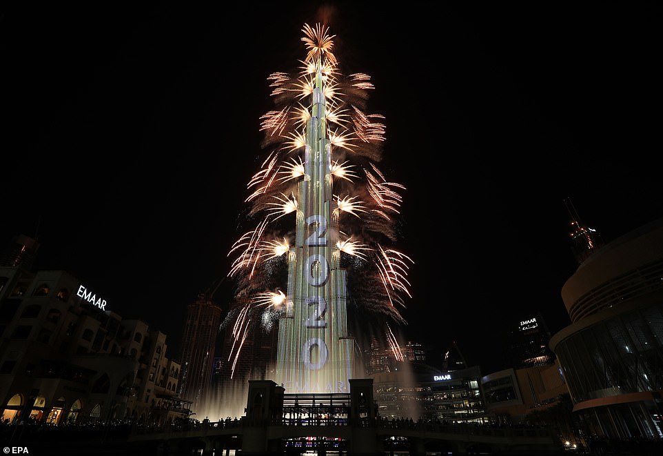 Fireworks illuminate the sky around Burj Khalifa, the tallest building in the world, during New Year's 2020 celebrations in the Gulf emirate of Dubai, United Arab Emirates, 01 January, 2020