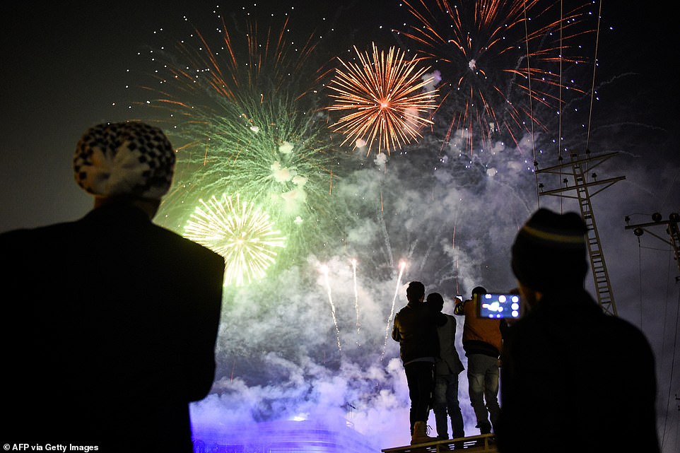 People watch fireworks as part of the New Year celebrations in Rawalpindi, Pakistan