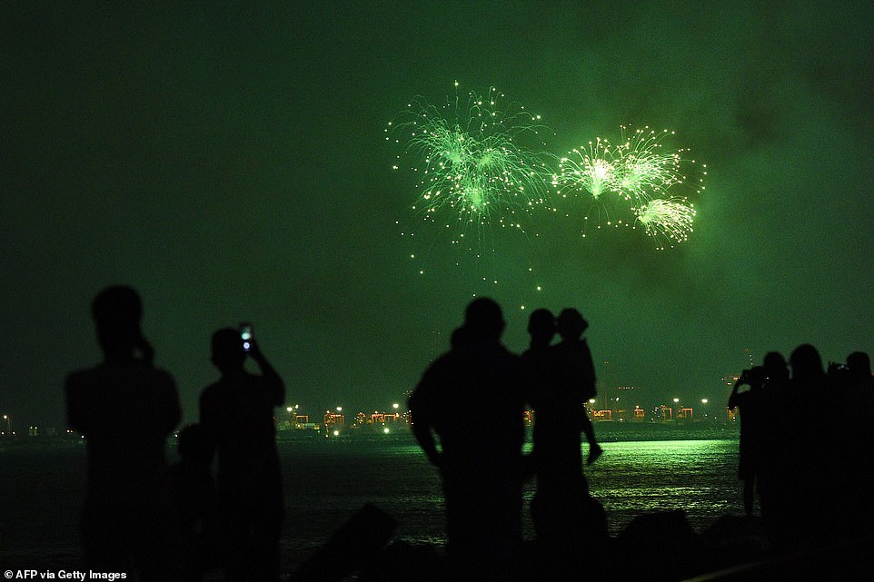 Sri Lankans watch fireworks during new year's celebrations in Colombo, on January 1, 2020