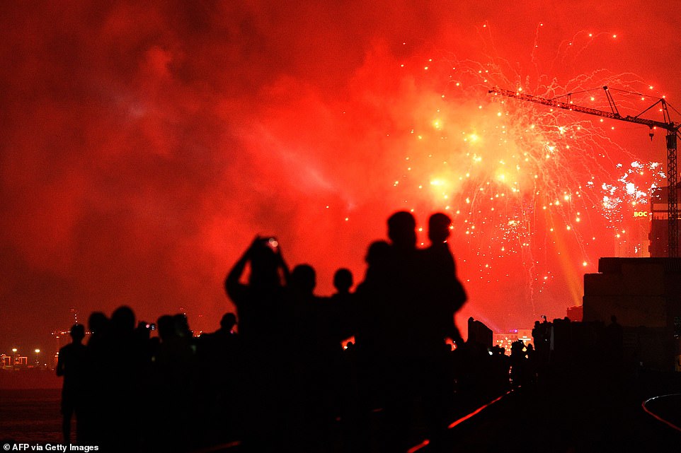 Sri Lankans watch fireworks during new year's celebrations in Colombo, on January 1, 2020