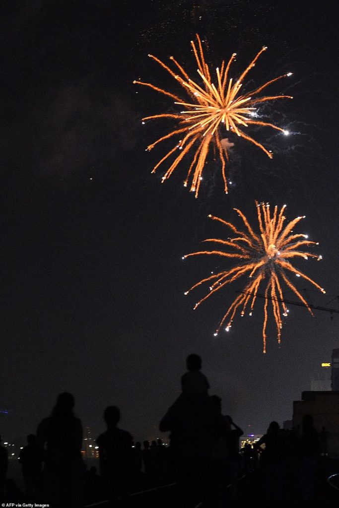 Sri Lankans watch fireworks during new year's celebrations in Colombo, on January 1, 2020